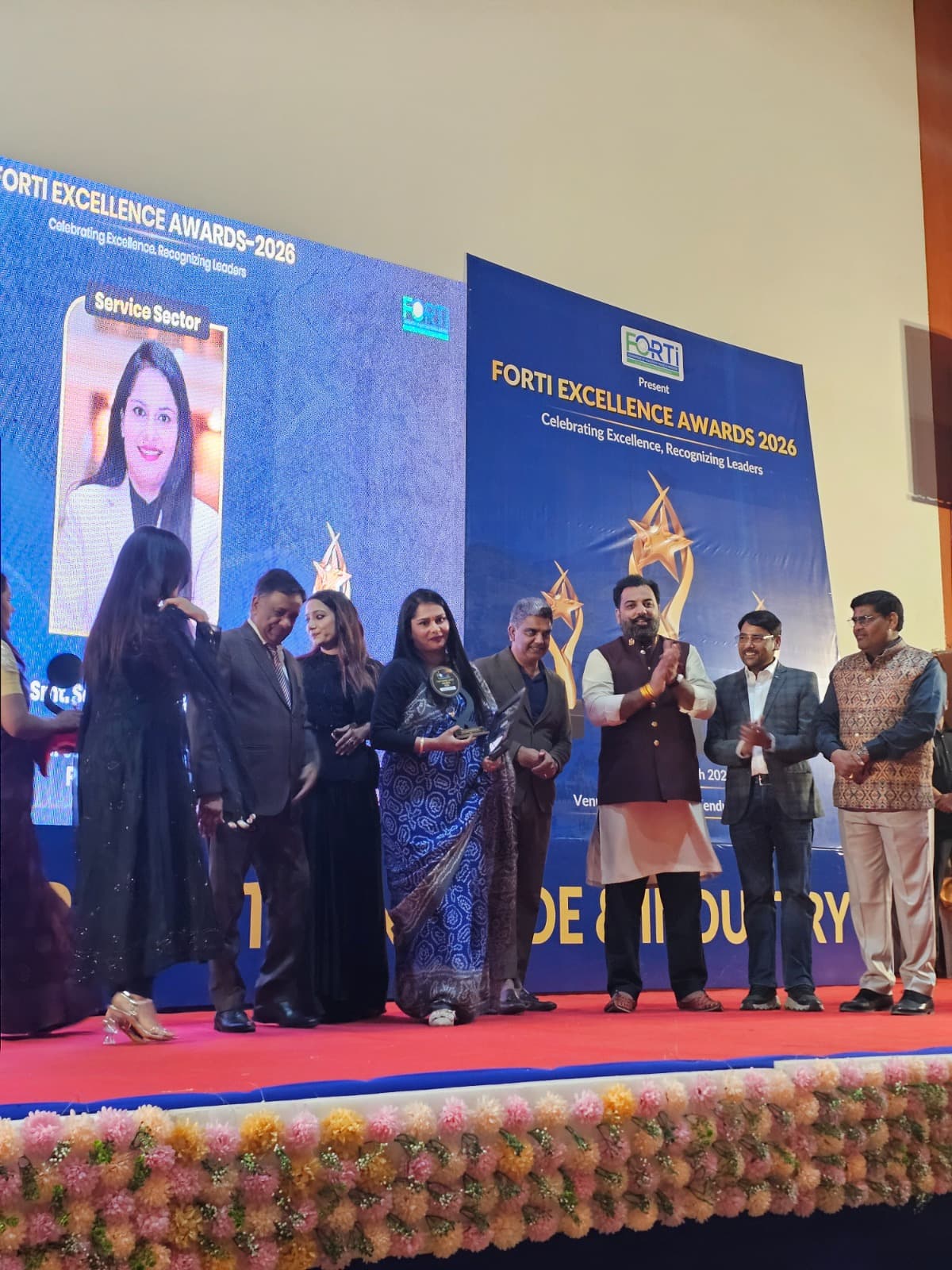 CA Sonam Khandelwal receiving an excellence award